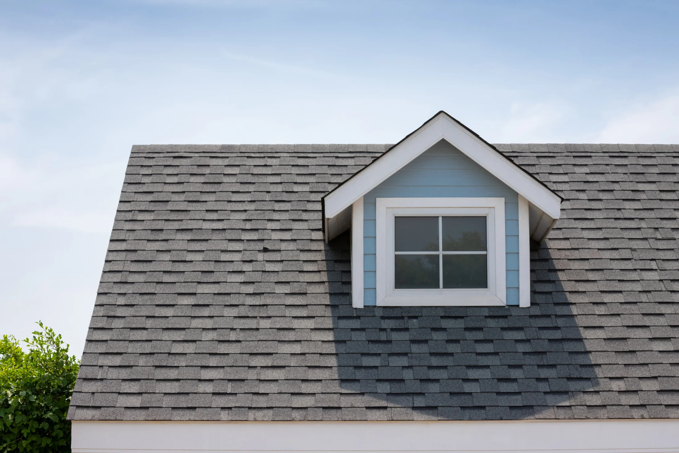 Newly installed gray asphalt shingle roof on a residential home in Southwest Florida, representing expert roofing installation by Dried-In LLC.