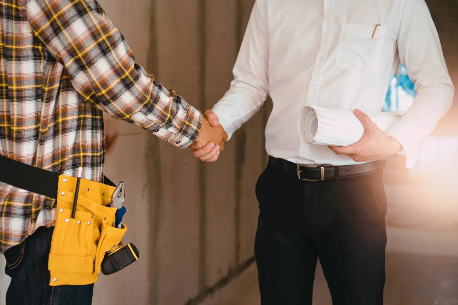 Roofers shaking hands