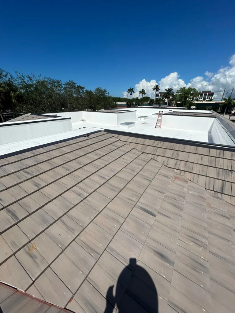 Completed concrete tile and TPO commercial roofing systems at Plaza Halstatt